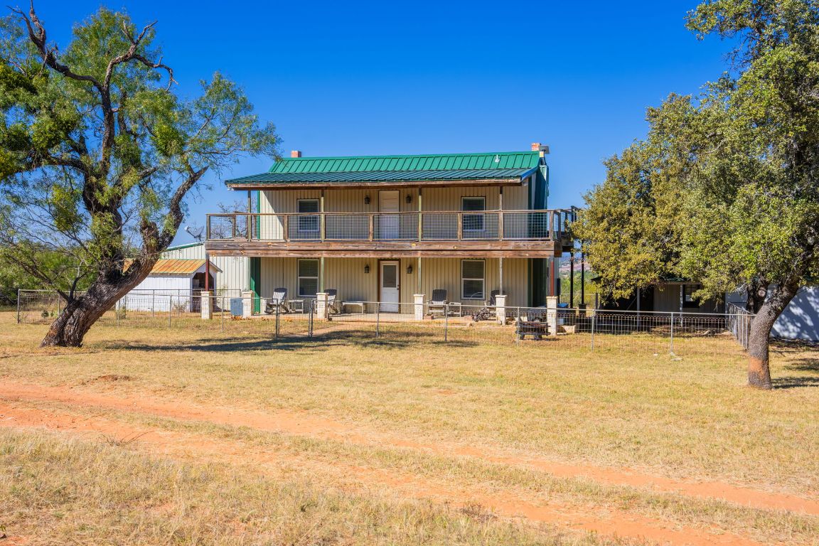 527 Walter Road Fredericksburg, TX 78624 - Photo 24 of 39 a view of a house with swimming pool and sitting area