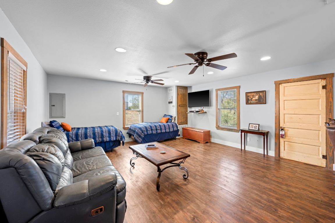 527 Walter Road Fredericksburg, TX 78624 - Photo 29 of 39 a living room with furniture and wooden floor