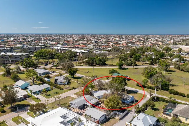 an aerial view of residential houses with outdoor space