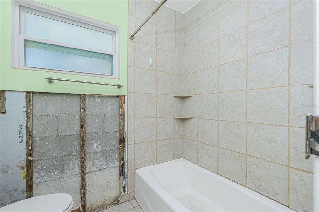 434 West Grace Street Punta Gorda, FL 33950 - Photo 27 of 64 a bathroom with a shower and a toilet