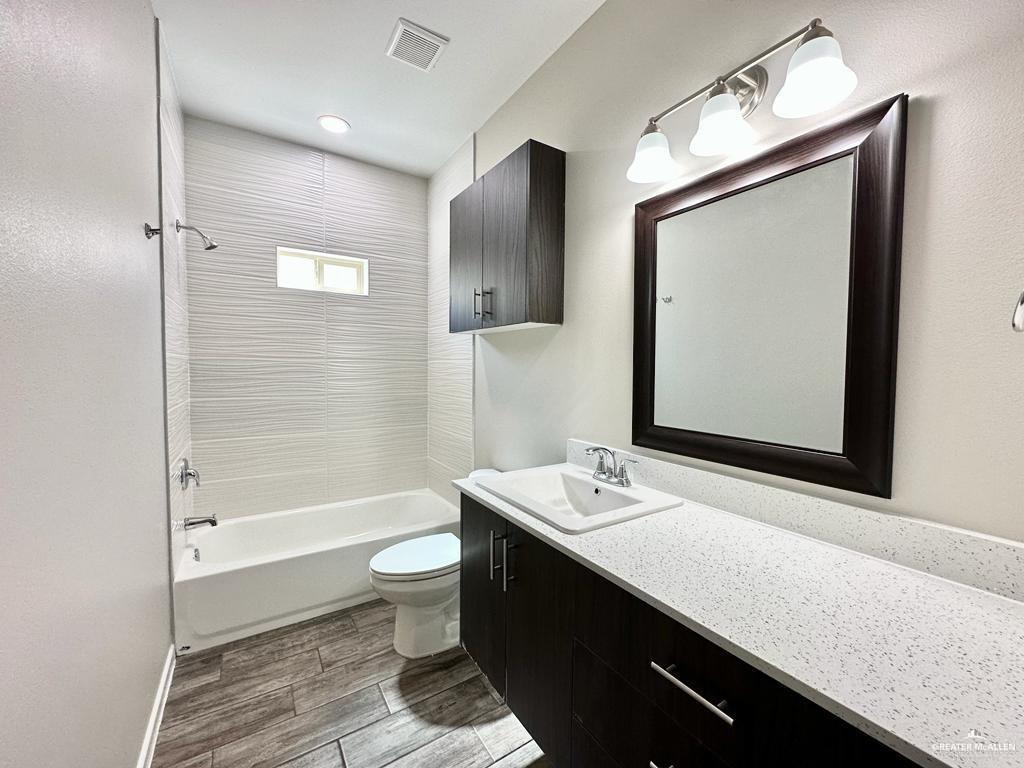 810 Starr Street Mercedes, TX 78570 - Photo 13 of 25 a bathroom with a sink a toilet and shower