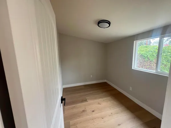 a view of an empty room and window