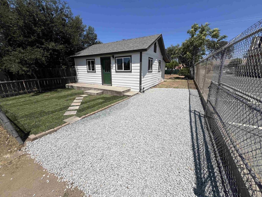 1021 D Street Ramona, CA 92065 - Photo 2 of 27 a view of a house with backyard and trees