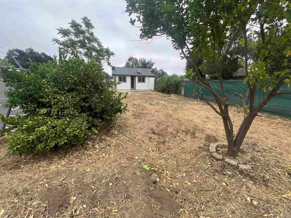 a view of backyard with green space