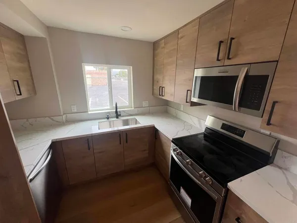 a kitchen with a stove and a microwave