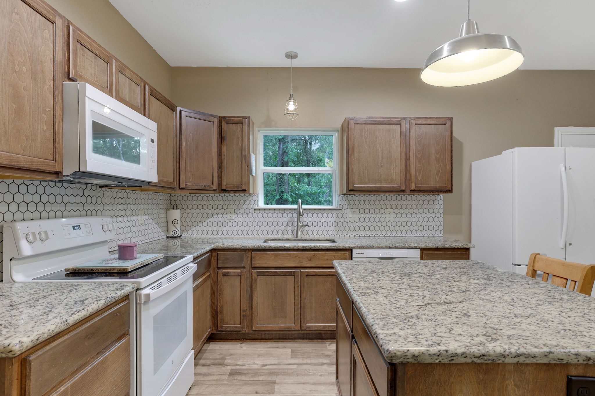 97 Harrell Road Coldspring, TX 77331 - Photo 8 of 31 Ample counter space for meal prep and plenty of storage to keep everything organized
