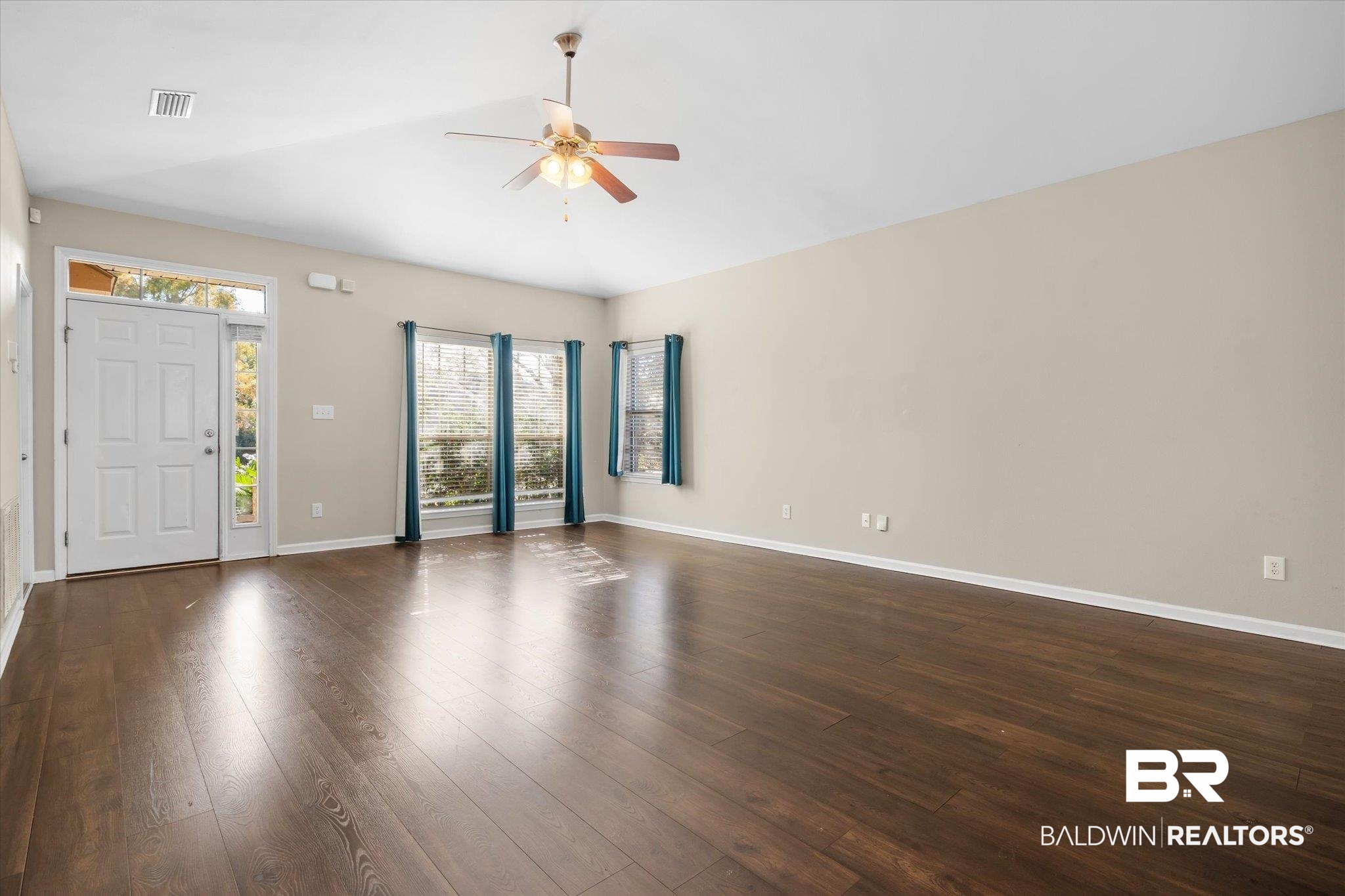 10251 Fionn Loop Daphne, AL 36526 - Photo 2 of 28 Interior space with dark hardwood / wood-style floors and ceiling fan