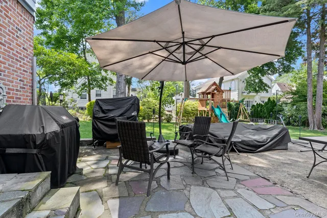 a view of a backyard with sitting area and furniture