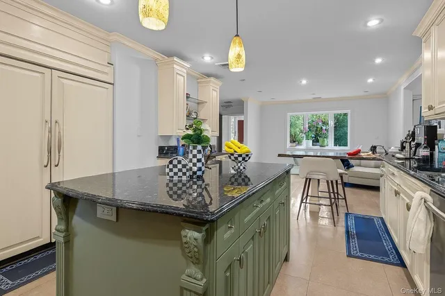 a kitchen with stainless steel appliances granite countertop a sink counter space cabinets and a window