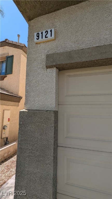 9121 Watermelon Seed Avenue Las Vegas, NV 89143 - Photo 2 of 21 Exterior view of stucco siding