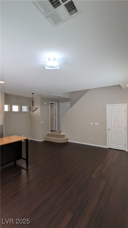 9121 Watermelon Seed Avenue Las Vegas, NV 89143 - Photo 4 of 21 Below grade area featuring dark wood-style flooring and baseboards