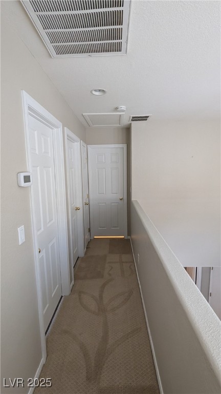 9121 Watermelon Seed Avenue Las Vegas, NV 89143 - Photo 9 of 21 Corridor with carpet floors, attic access, and recessed lighting