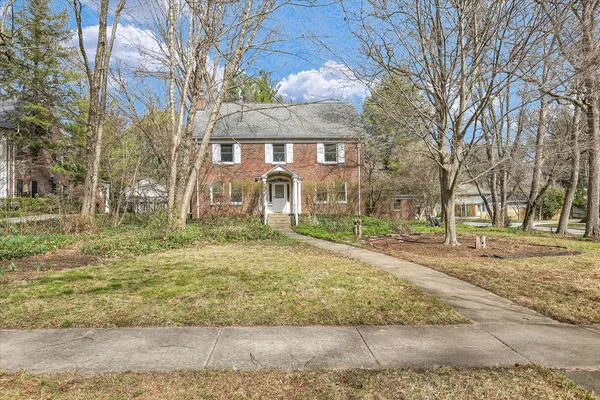 a front view of a house with a large window