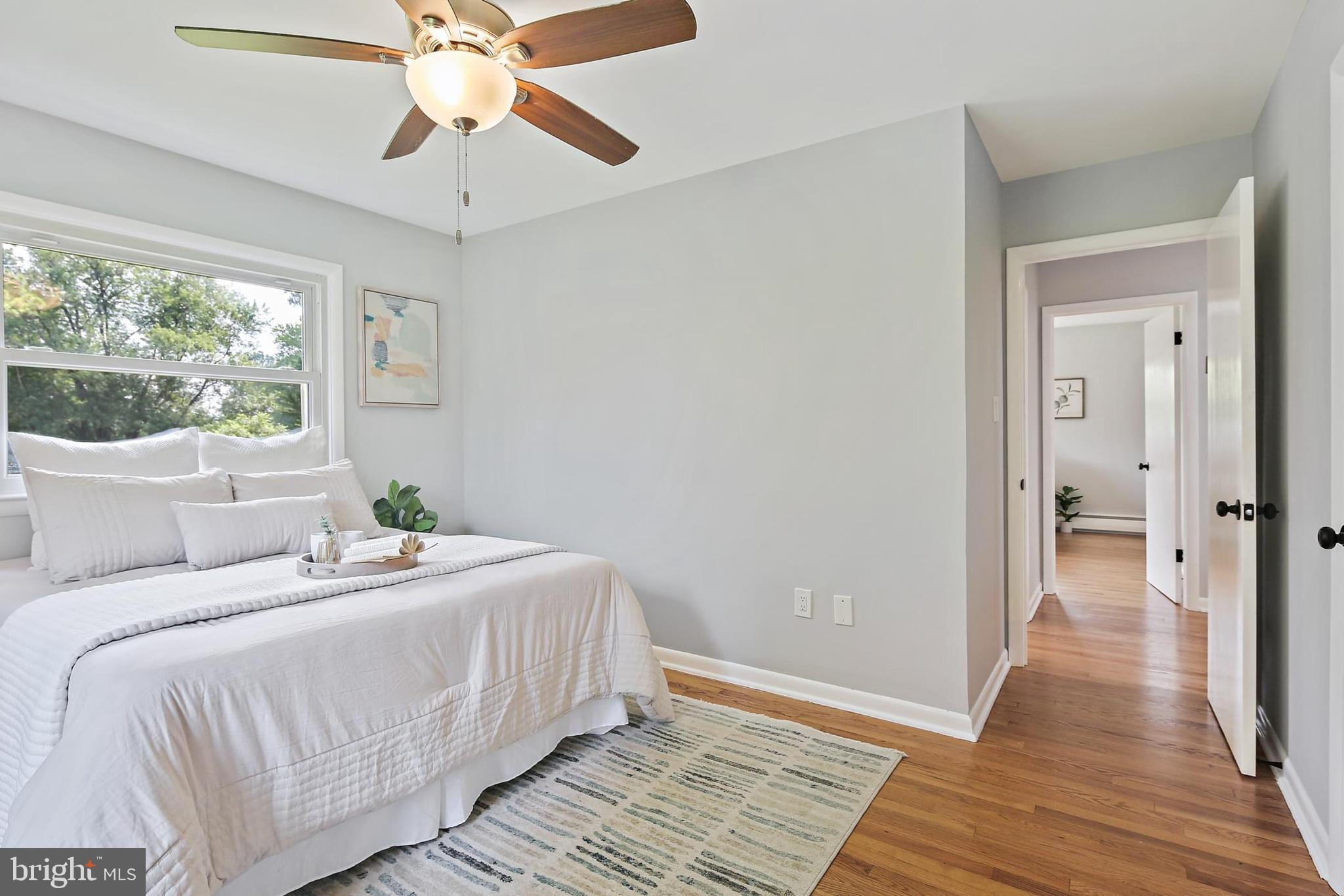 1516 Singer Road Joppa, MD 21085 - Photo 13 of 39 a bedroom with bed and a chandelier