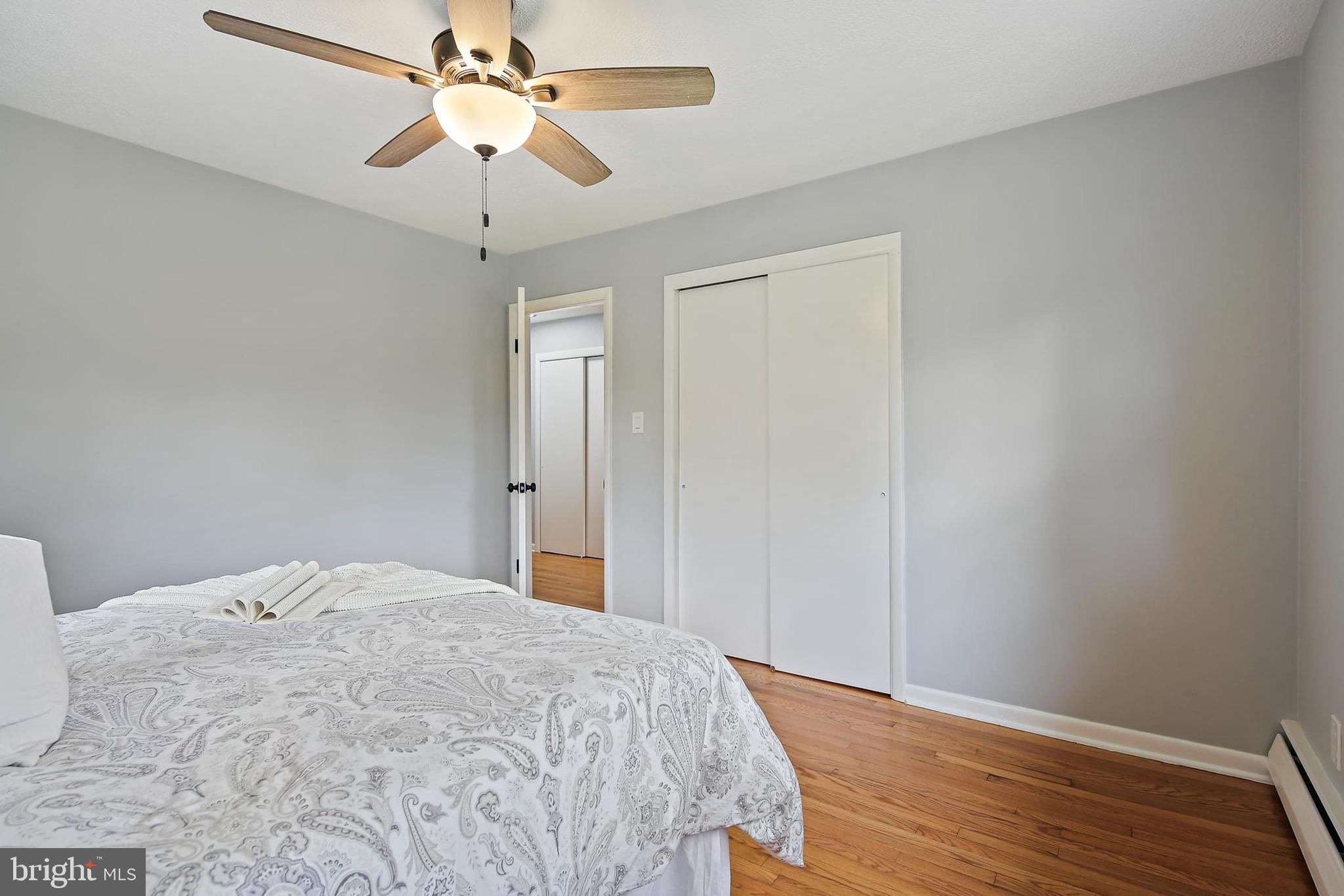 1516 Singer Road Joppa, MD 21085 - Photo 18 of 39 a bedroom with a bed and a chandelier