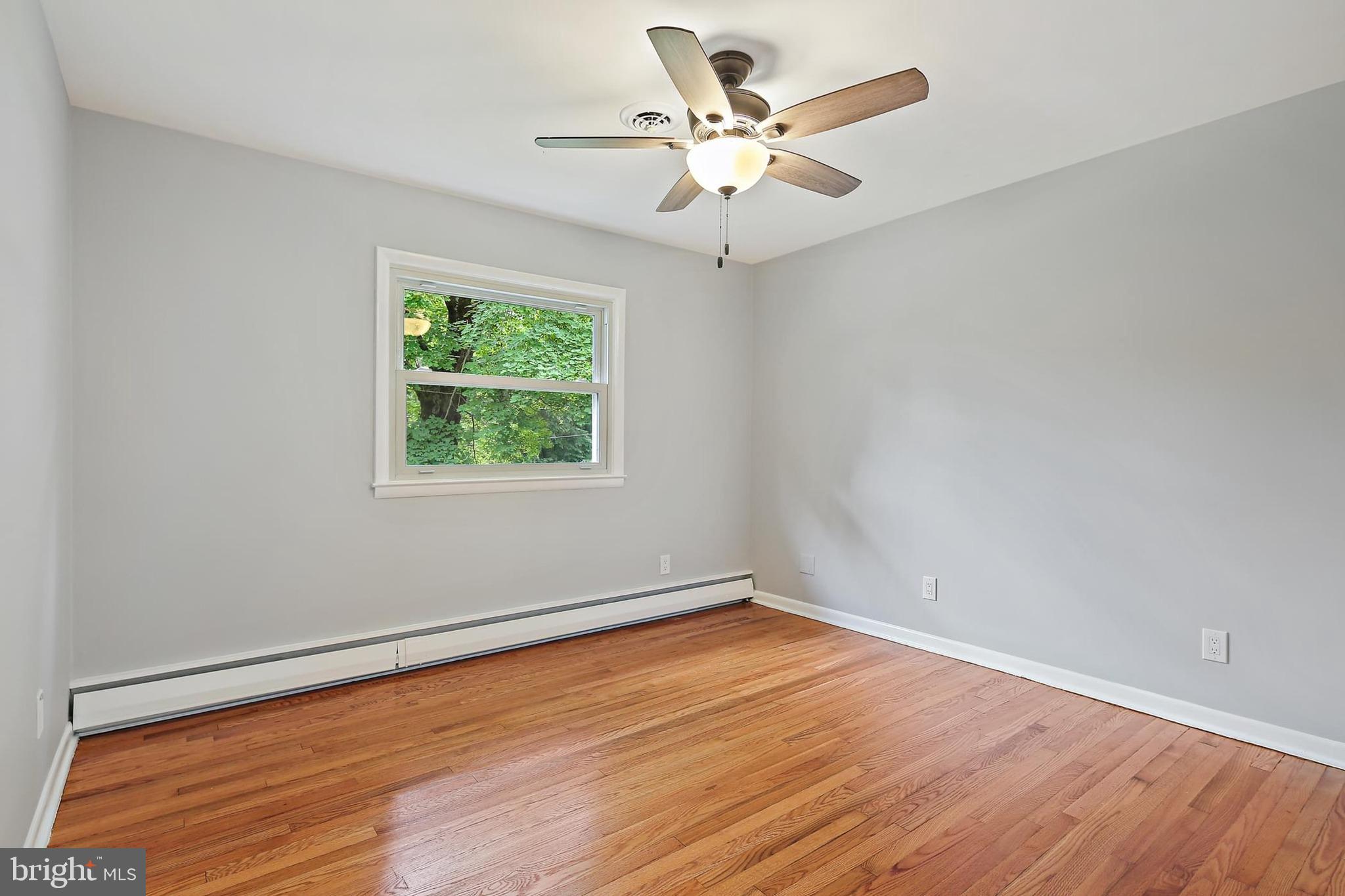1516 Singer Road Joppa, MD 21085 - Photo 19 of 39 wooden floor in an empty room with a window