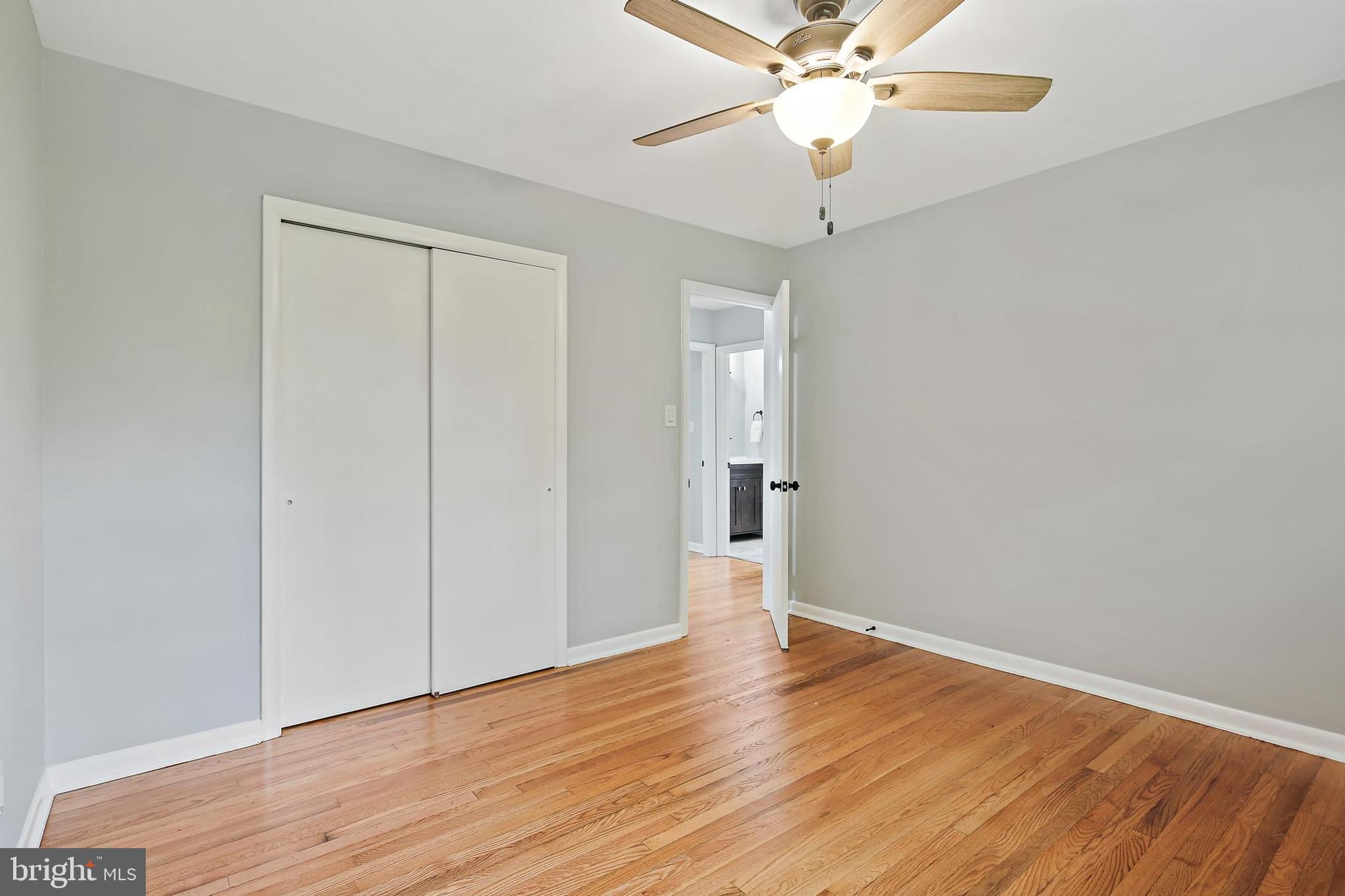 1516 Singer Road Joppa, MD 21085 - Photo 20 of 39 a view of an empty room with wooden floor