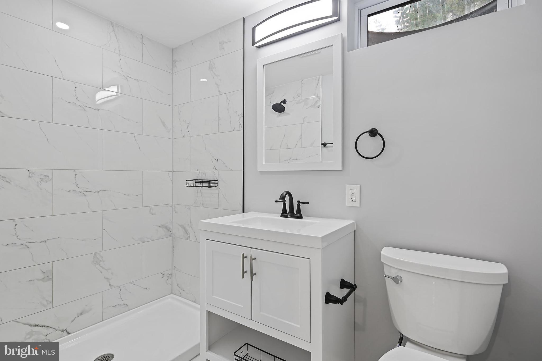 1516 Singer Road Joppa, MD 21085 - Photo 24 of 39 a bathroom with a toilet sink and shower