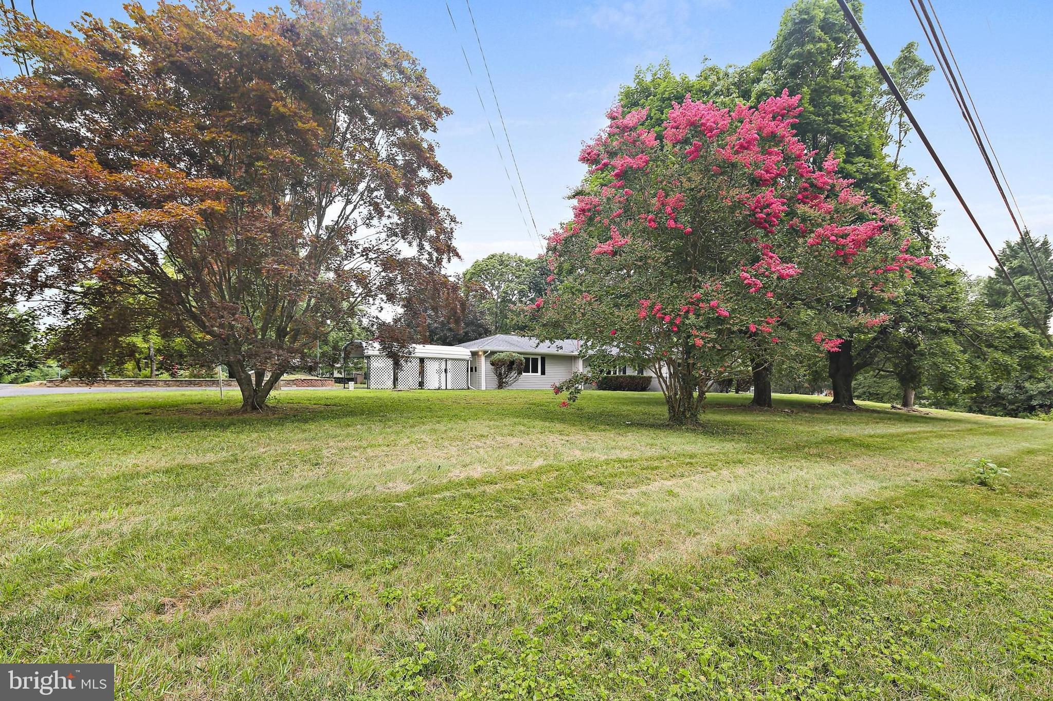 1516 Singer Road Joppa, MD 21085 - Photo 31 of 39 a front view of house with yard and trees in background