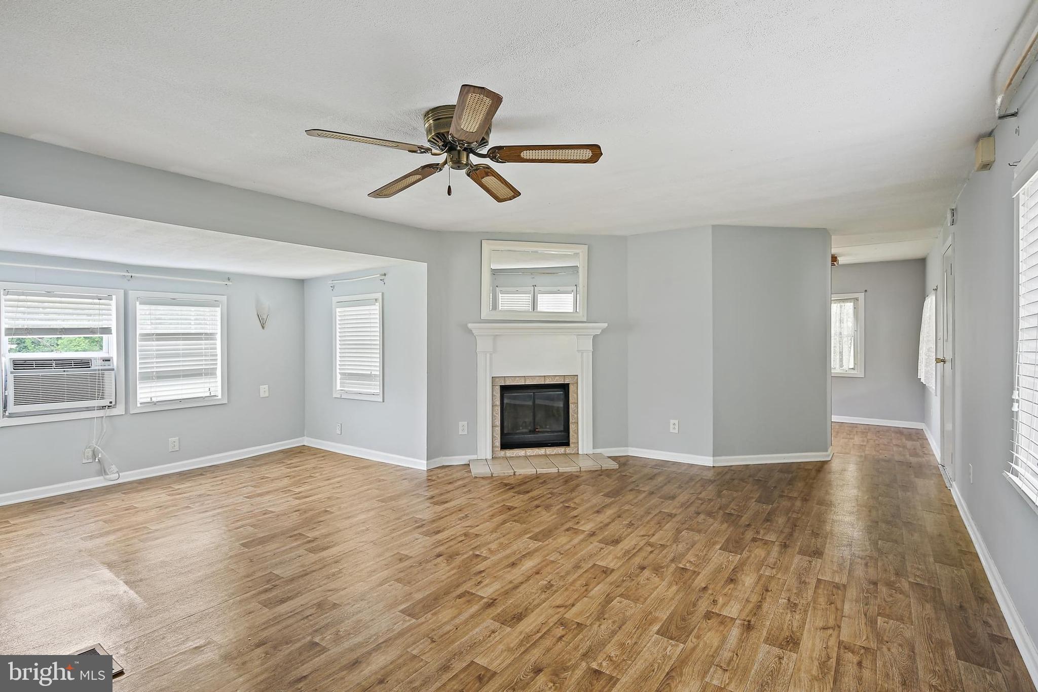 1516 Singer Road Joppa, MD 21085 - Photo 34 of 39 a view of empty room with wooden floor and window