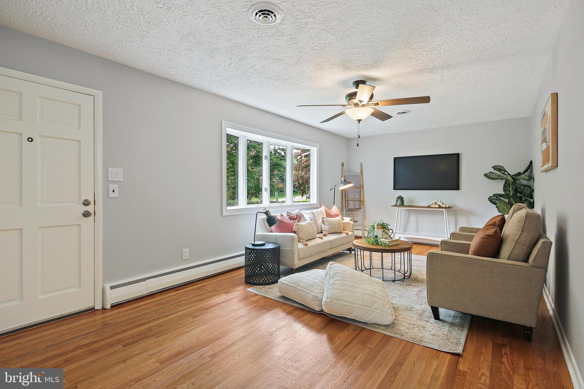 1516 Singer Road Joppa, MD 21085 - Photo 5 of 39 a living room with furniture and a flat screen tv