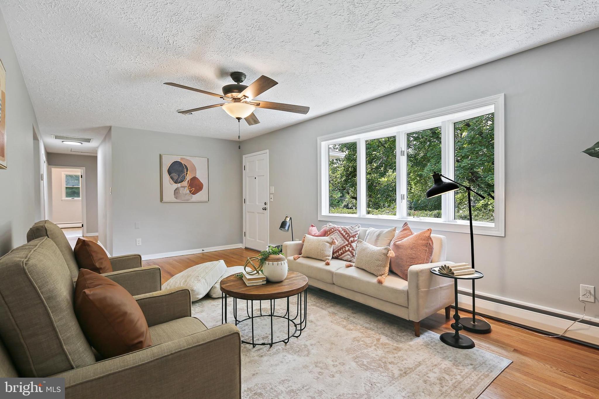1516 Singer Road Joppa, MD 21085 - Photo 6 of 39 a living room with furniture and a large window