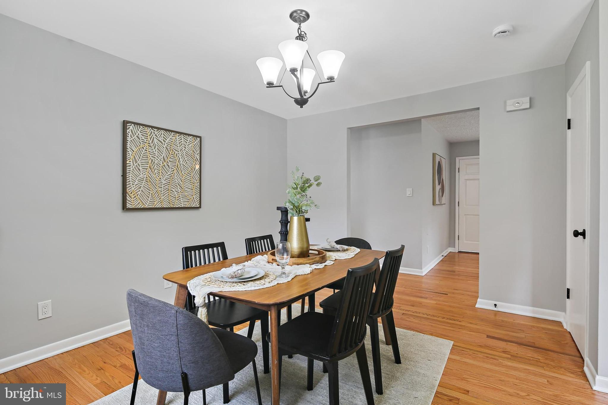 1516 Singer Road Joppa, MD 21085 - Photo 8 of 39 a dining room with furniture and chandelier