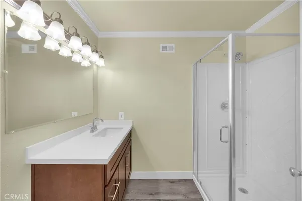 a bathroom with a sink vanity and a mirror