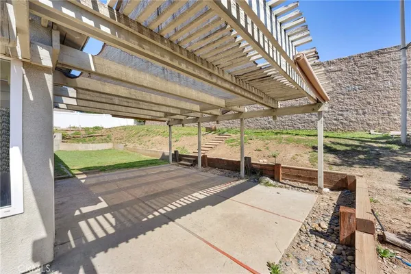 a view of a porch with a floor to ceiling windows