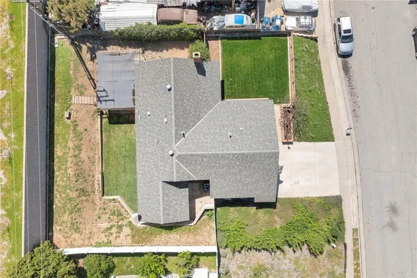 an aerial view of a house having yard
