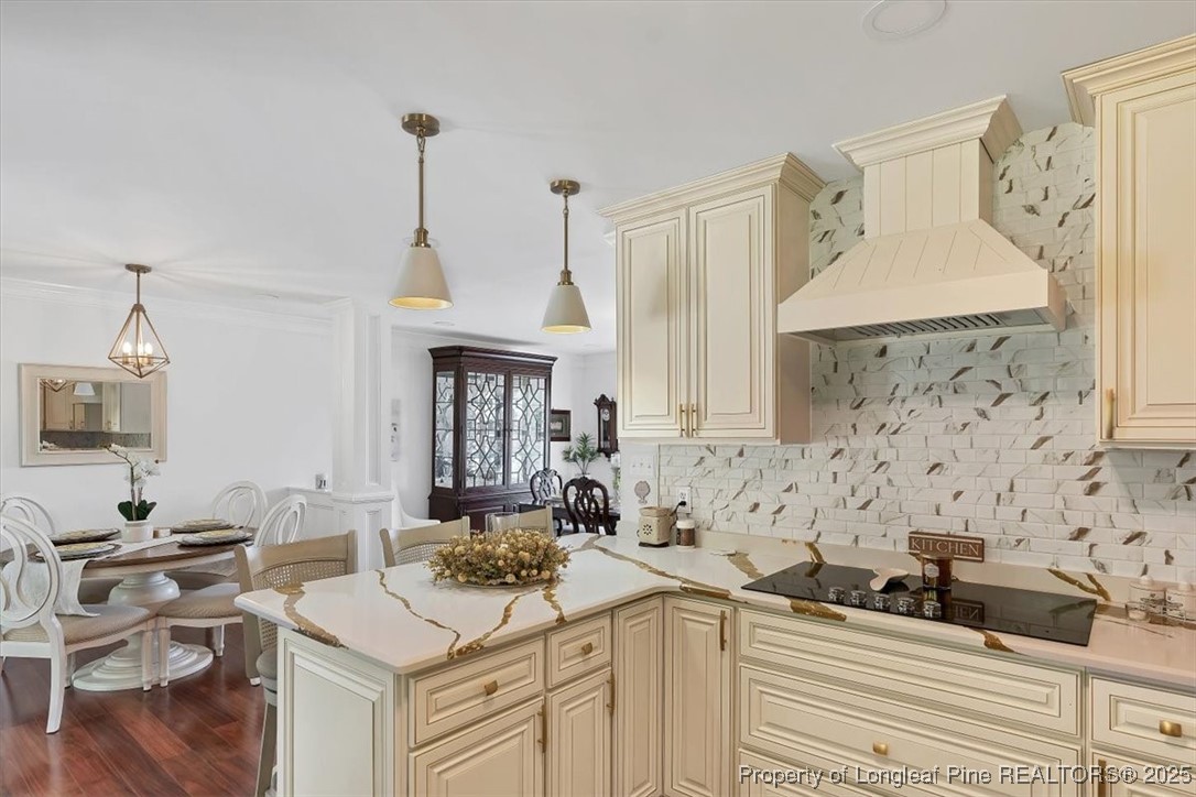2483 West Carthage Road Lumberton, NC 28360 - Photo 14 of 50 a kitchen with a sink dishwasher a stove and white cabinets with wooden floor