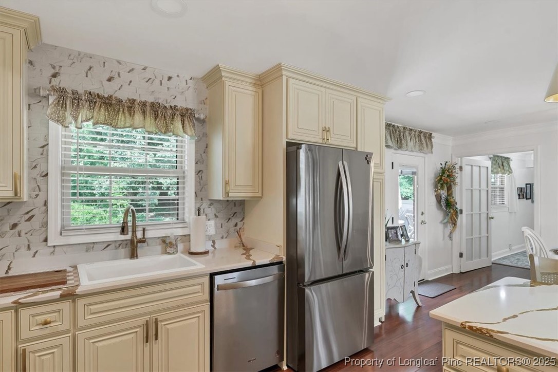 2483 West Carthage Road Lumberton, NC 28360 - Photo 17 of 50 a kitchen with stainless steel appliances a refrigerator sink and cabinets