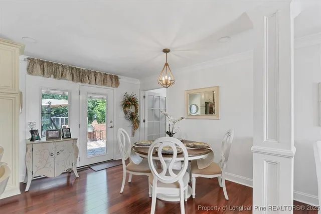 a view of a hallway with closet and mirror