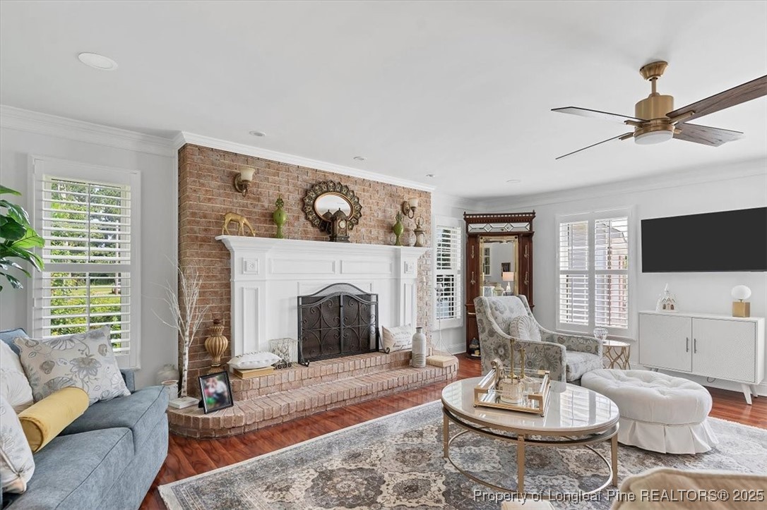 2483 West Carthage Road Lumberton, NC 28360 - Photo 20 of 50 a living room with furniture a flat screen tv and a fireplace