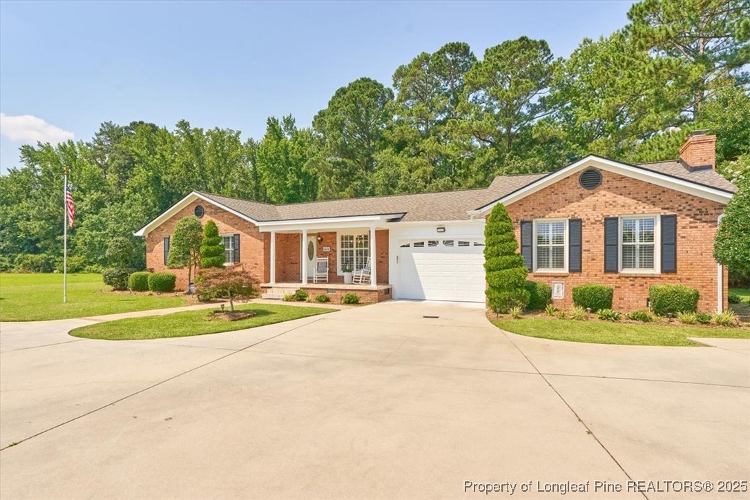 2483 West Carthage Road Lumberton, NC 28360 - Photo 2 of 50 a front view of a house with a yard and porch
