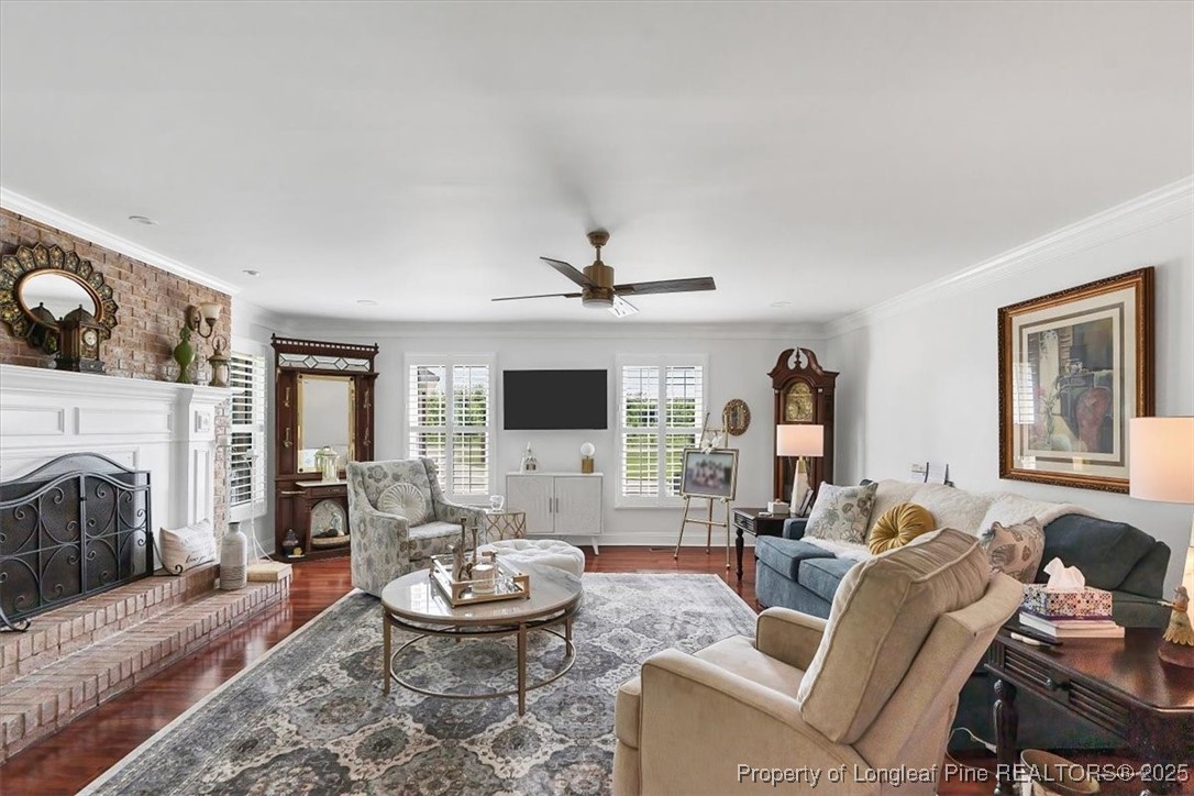 2483 West Carthage Road Lumberton, NC 28360 - Photo 25 of 50 a living room with furniture a fireplace and a flat screen tv
