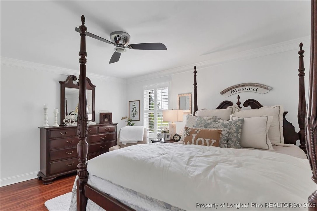 2483 West Carthage Road Lumberton, NC 28360 - Photo 32 of 50 a bedroom with a bed and wooden furniture