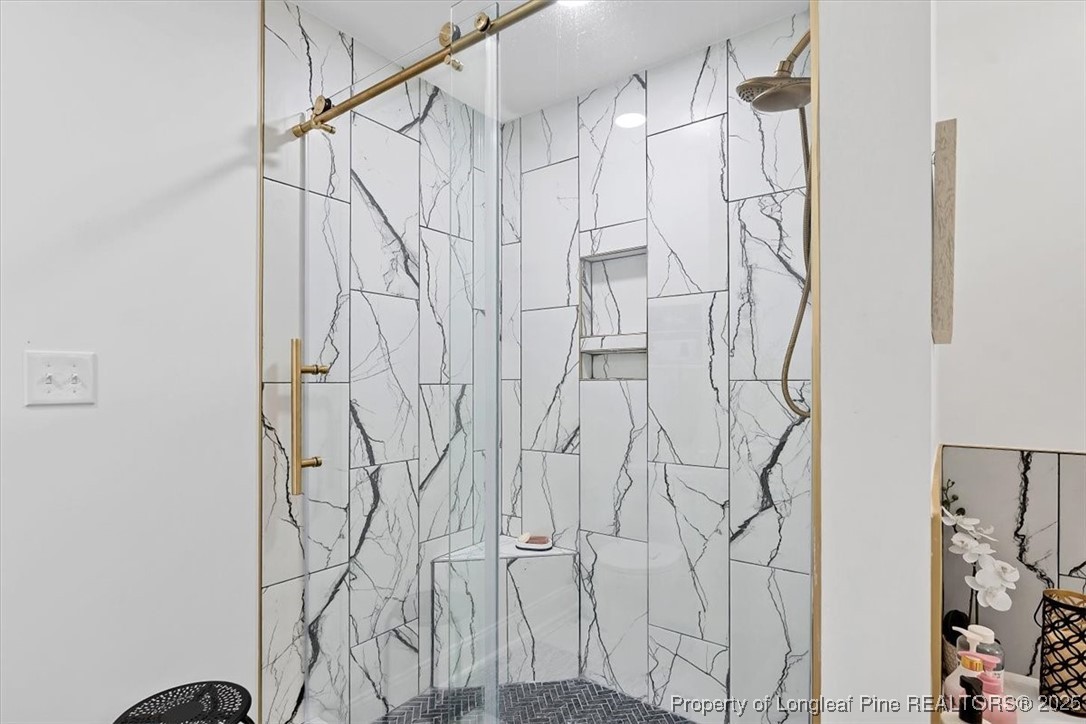 2483 West Carthage Road Lumberton, NC 28360 - Photo 34 of 50 a bathroom with a shower and a shower curtain