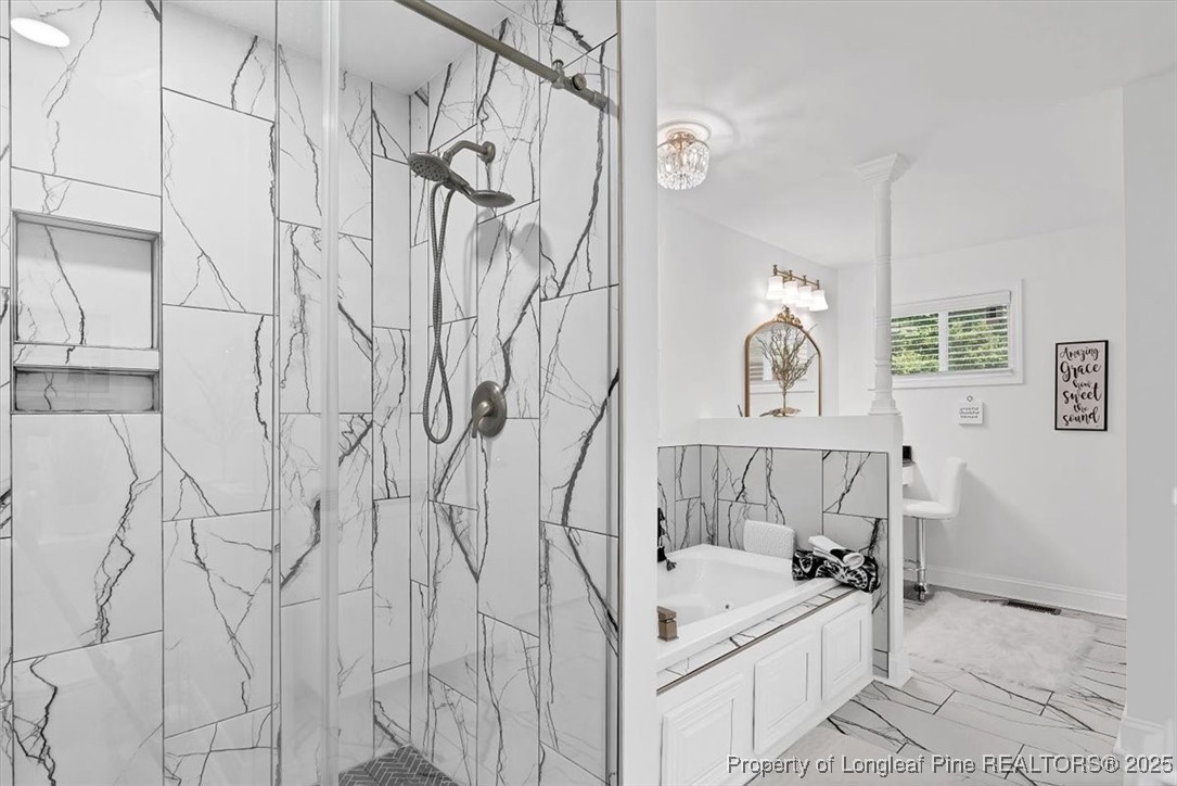 2483 West Carthage Road Lumberton, NC 28360 - Photo 35 of 50 a bathroom with a sink and a bathtub