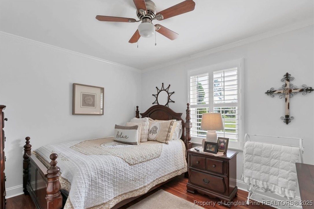 2483 West Carthage Road Lumberton, NC 28360 - Photo 42 of 50 a bedroom with a bed and a chandelier