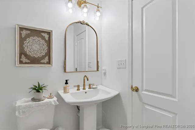 a view of a patio with table and chairs and potted plants