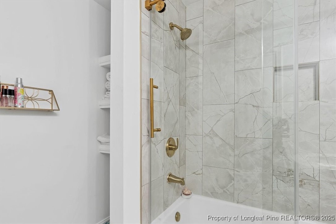 2483 West Carthage Road Lumberton, NC 28360 - Photo 45 of 50 a bathroom with a bathtub and shower