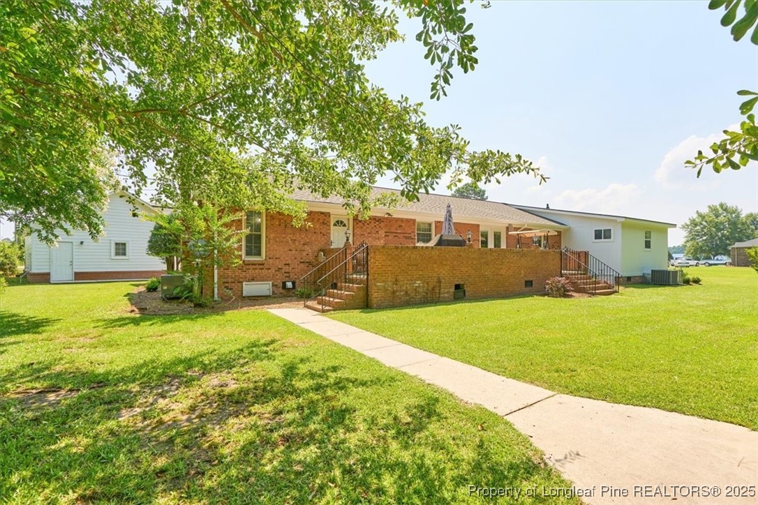 2483 West Carthage Road Lumberton, NC 28360 - Photo 48 of 50 a view of a backyard with a garden