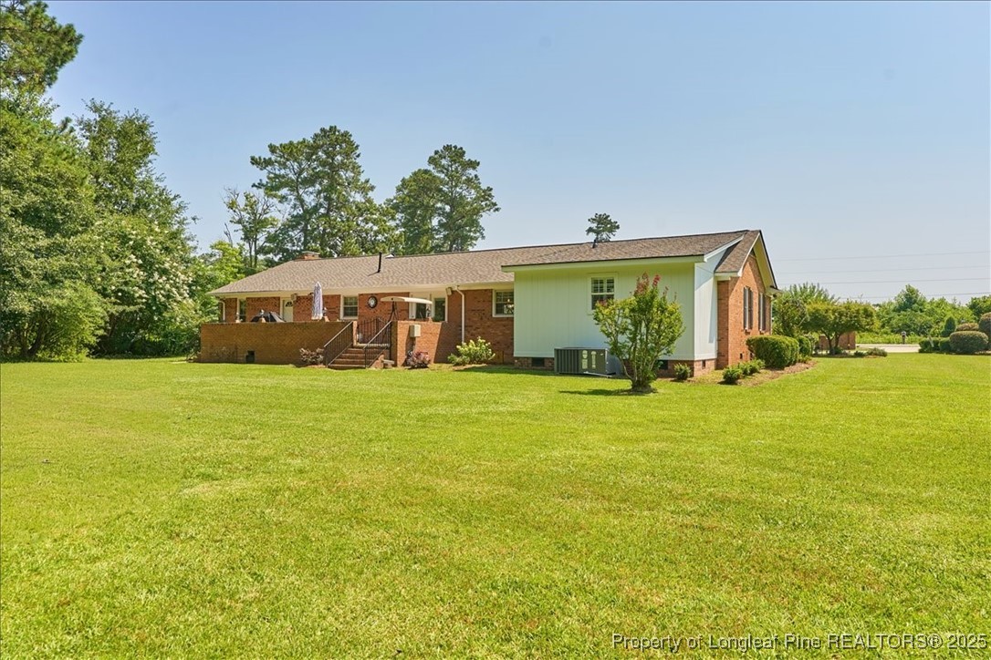 2483 West Carthage Road Lumberton, NC 28360 - Photo 49 of 50 a front view of house with an outdoor space and seating
