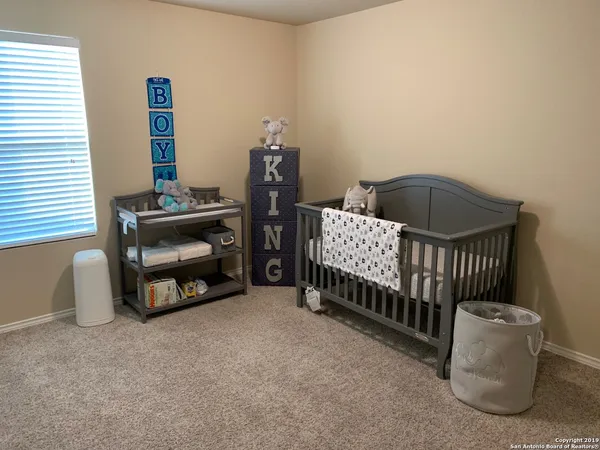 a view of outdoor space with swimming pool and wooden fence