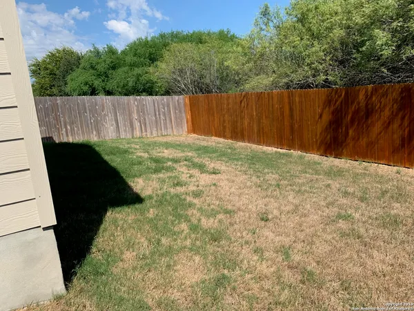 a view of a back yard of the house