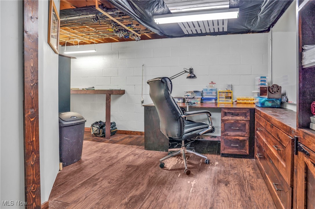 39233 Jones Road Litchfield, OH 44253 - Photo 31 of 46 Office area with wood finished floors and concrete block wall
