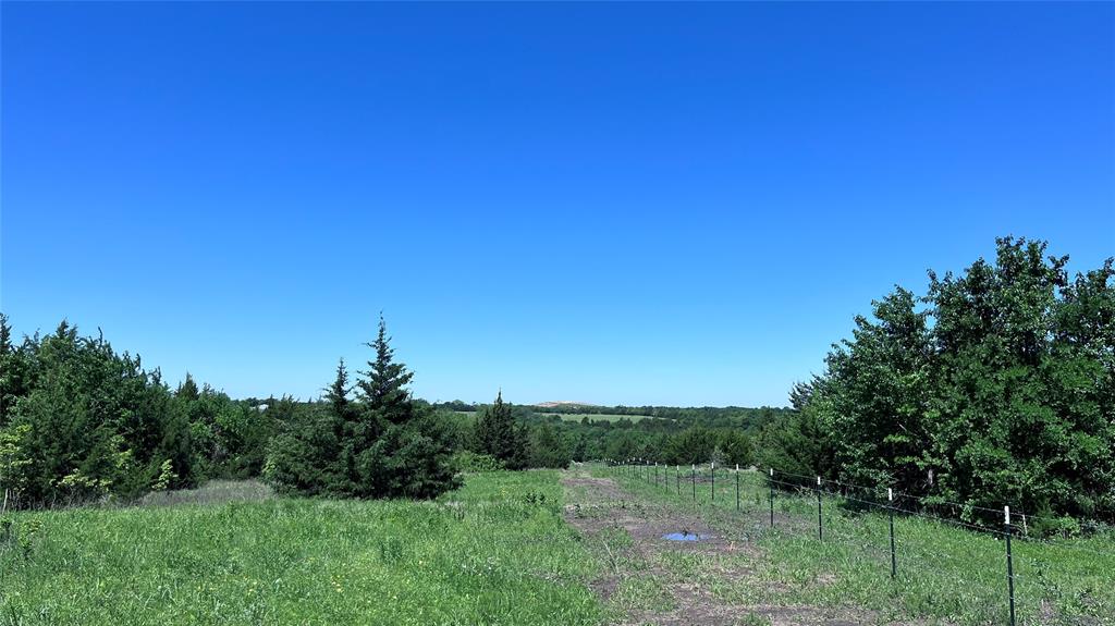 1 Key Road Sherman, TX 75090 - Photo 19 of 20 a view of a field with a tree in the background