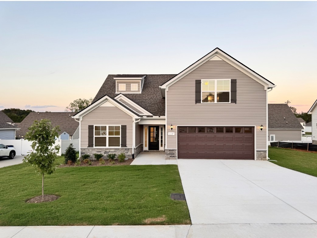 a front view of a house with a yard