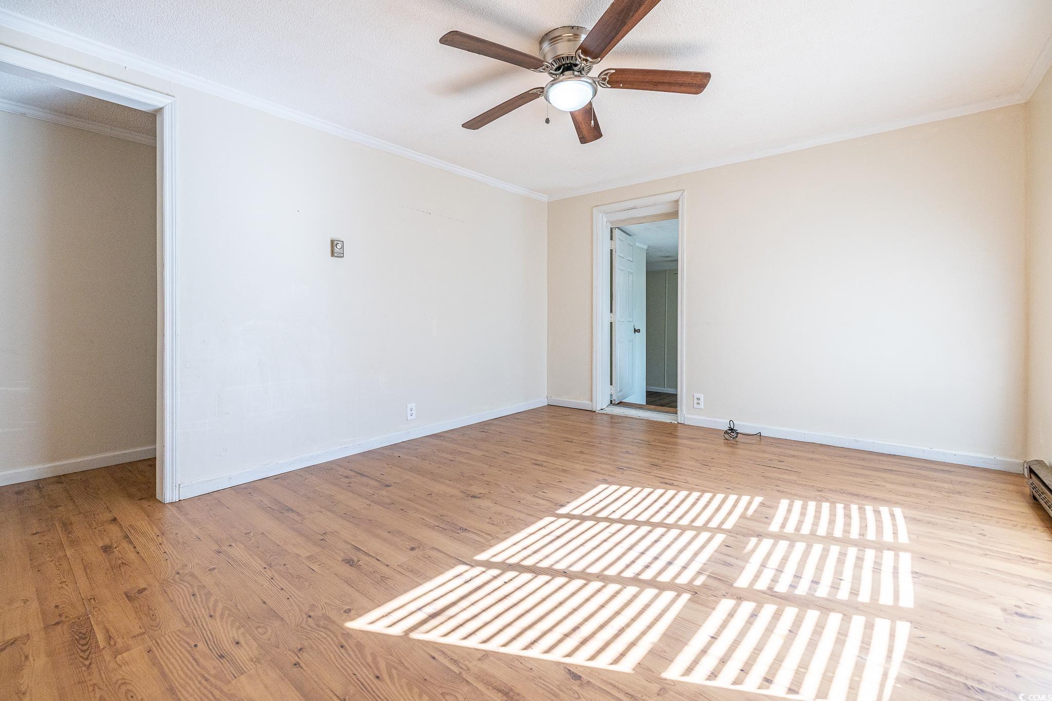 101 County Rd S-22-732 Georgetown, SC 29440 - Photo 5 of 17 Unfurnished room featuring crown molding, baseboar